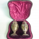 A PAIR OF STERLING SILVER PEPPER POTS BY WALKER & HALL, H/M SHEFFIELD 1897