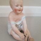 Antique Gebruder Heubach Bisque Porcelain Sitting Piano Baby Boy Figurine c.1910