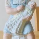 antique HEUBACH porcelain GIRL figure figurine with TOY DOLL